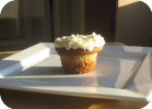 cupcakes with graham cracker crust and coconut cream icing